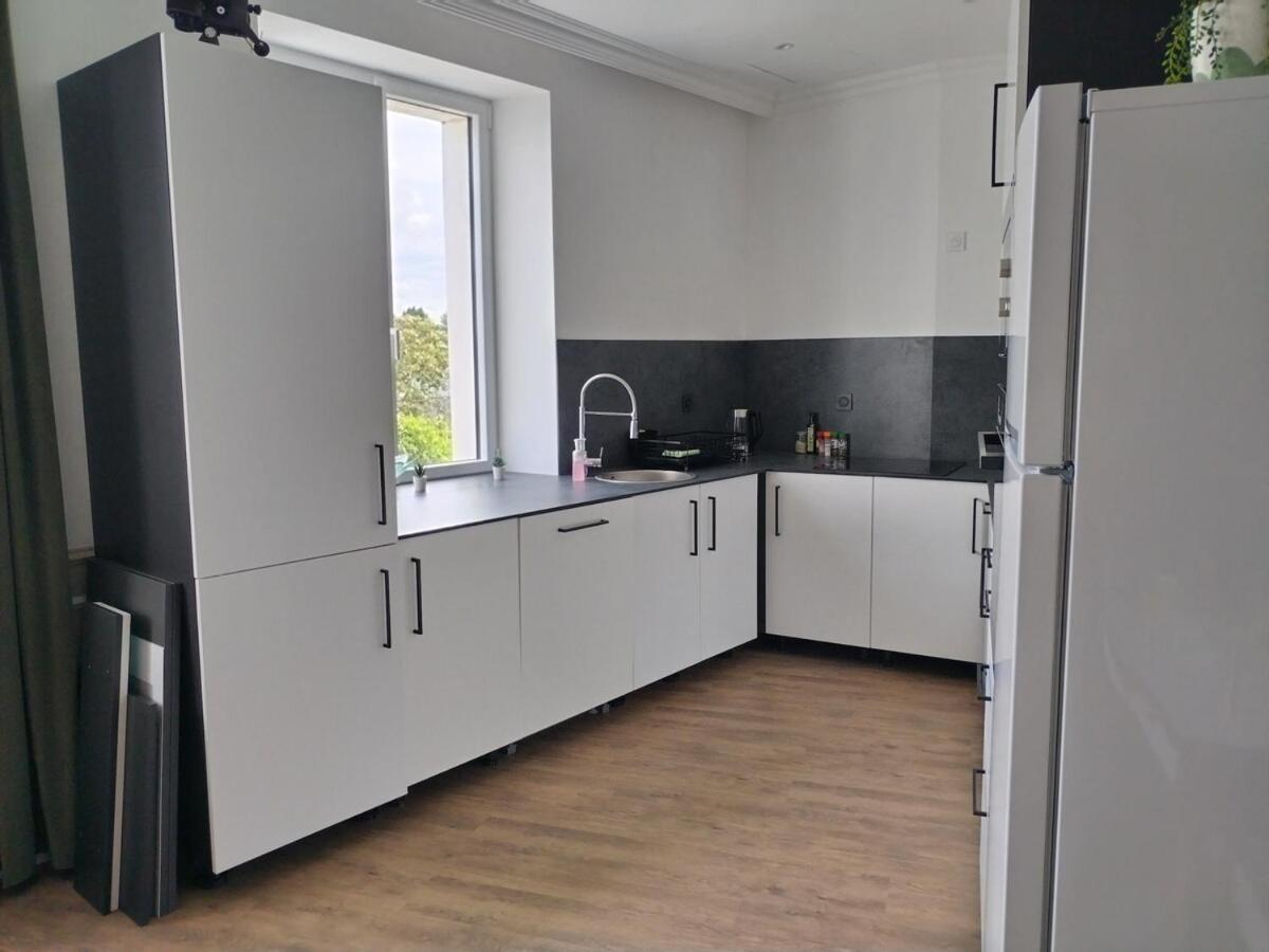 Le Familia Apartment Guer Luaran gambar